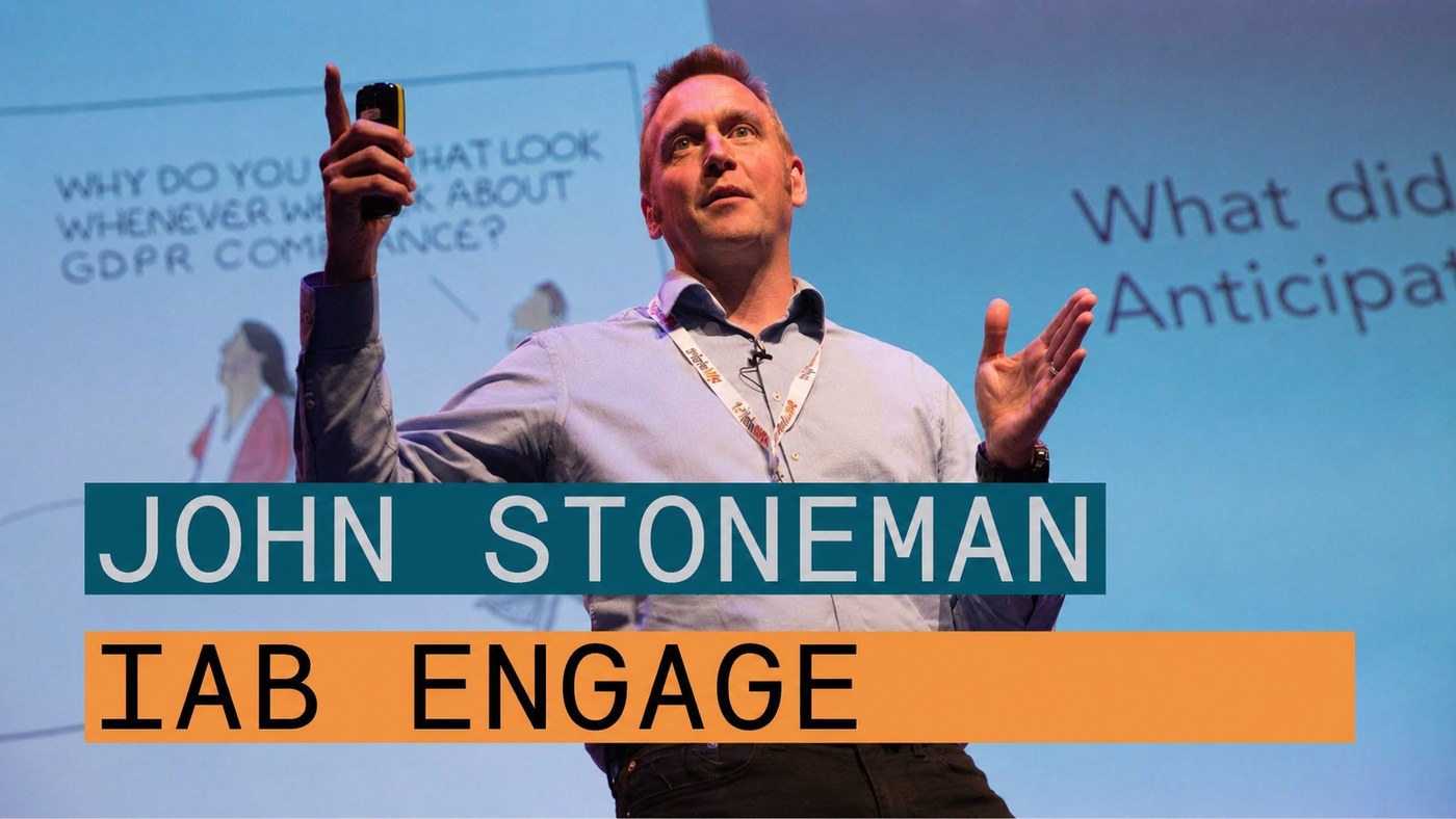 John Stoneman speaking on stage